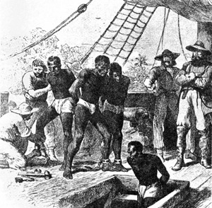 Captured Africans, are loaded into the hold of a ship.